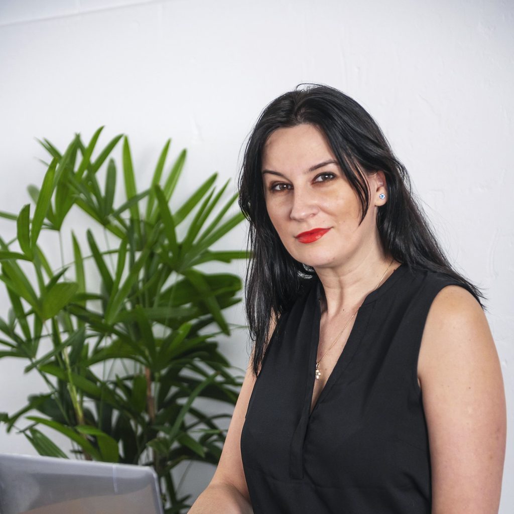 Alexandra Morosan at her laptop, ready for a consultation